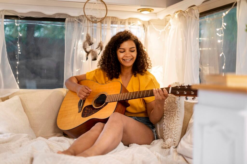 woman playing a guitar