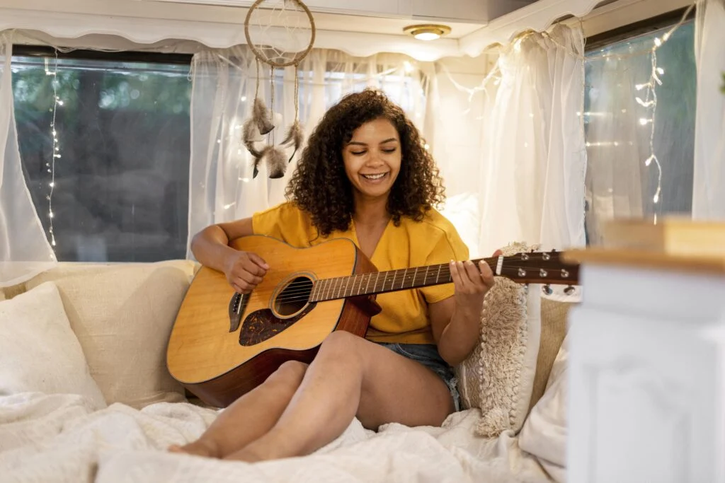 woman playing a guitar