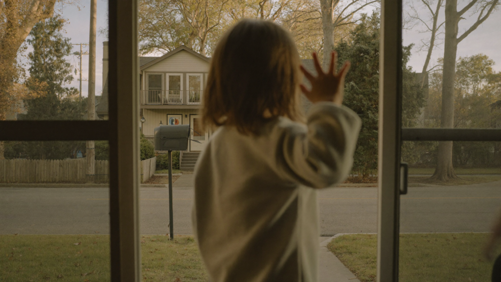 Girl Looking Outside The Window Waving