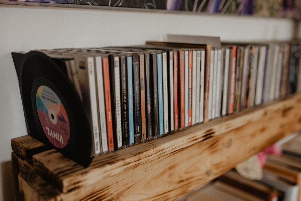 a shelf with a lot of cds on it