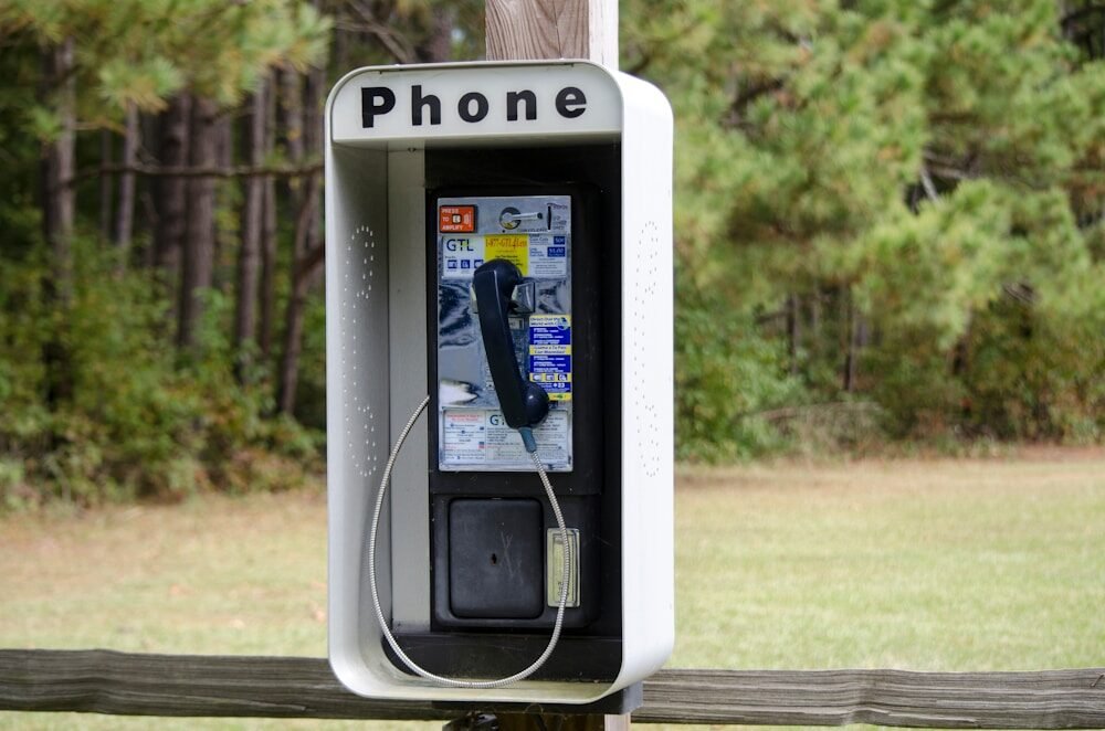 silver and black telephone booth