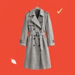 Illustration of a classic trench coat on a hanger with a checkmark and leaf