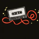 Vintage cassette tape with coral tape looping out on a black background