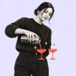 Illustration of a woman pouring drinks into two coral coupe glasses