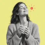 Illustration of a smiling woman in a cardigan holding a warm mug in the sun
